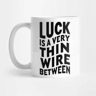 Luck is a very thin wire between Mug